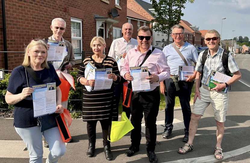 Andy and volunteers delivering survey