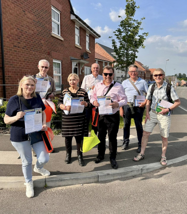 Andy and volunteers delivering survey