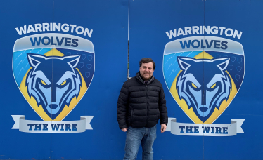 Andy Carter with the Warrington Wolves sign